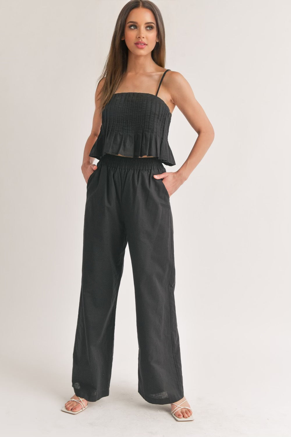 Sleeveless pleated top and wide pants