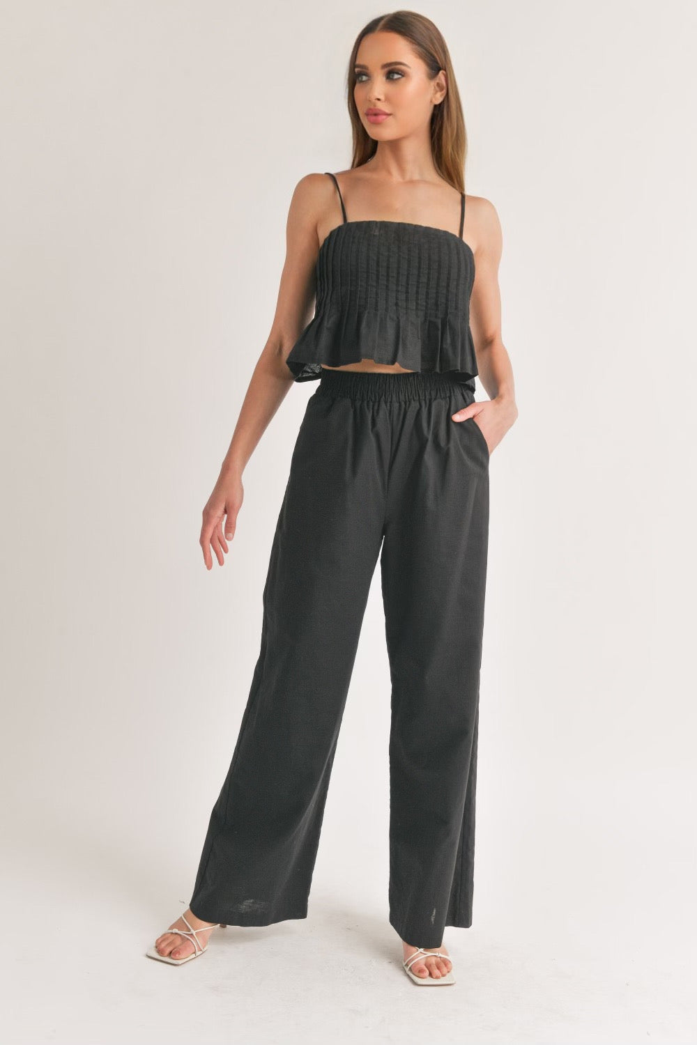 Sleeveless pleated top and wide pants